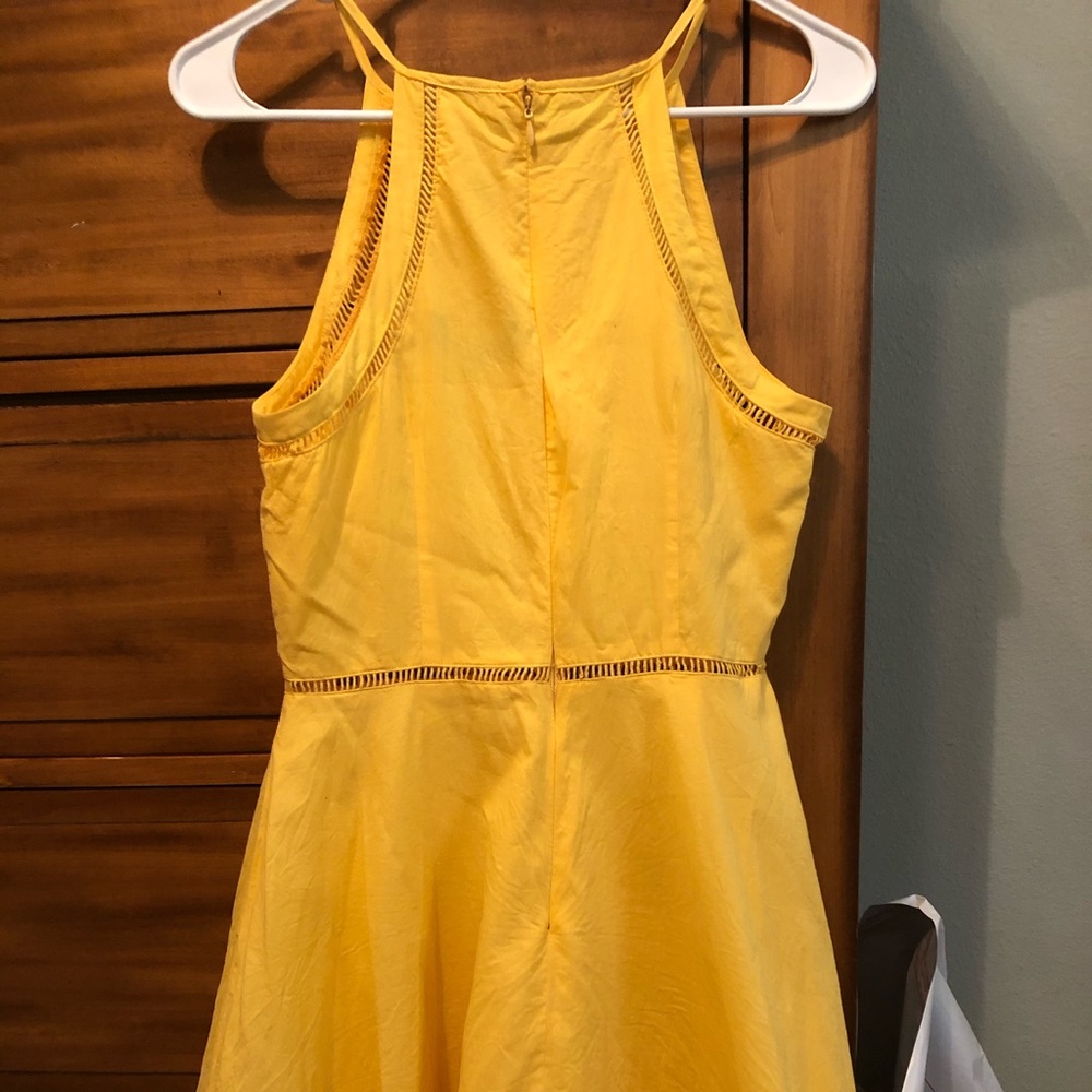 Bright, sunny-yellow handkerchief dress.